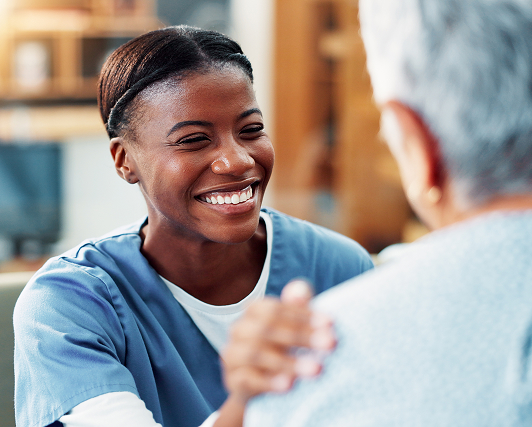 Caregiver smiling with senior in Atlanta